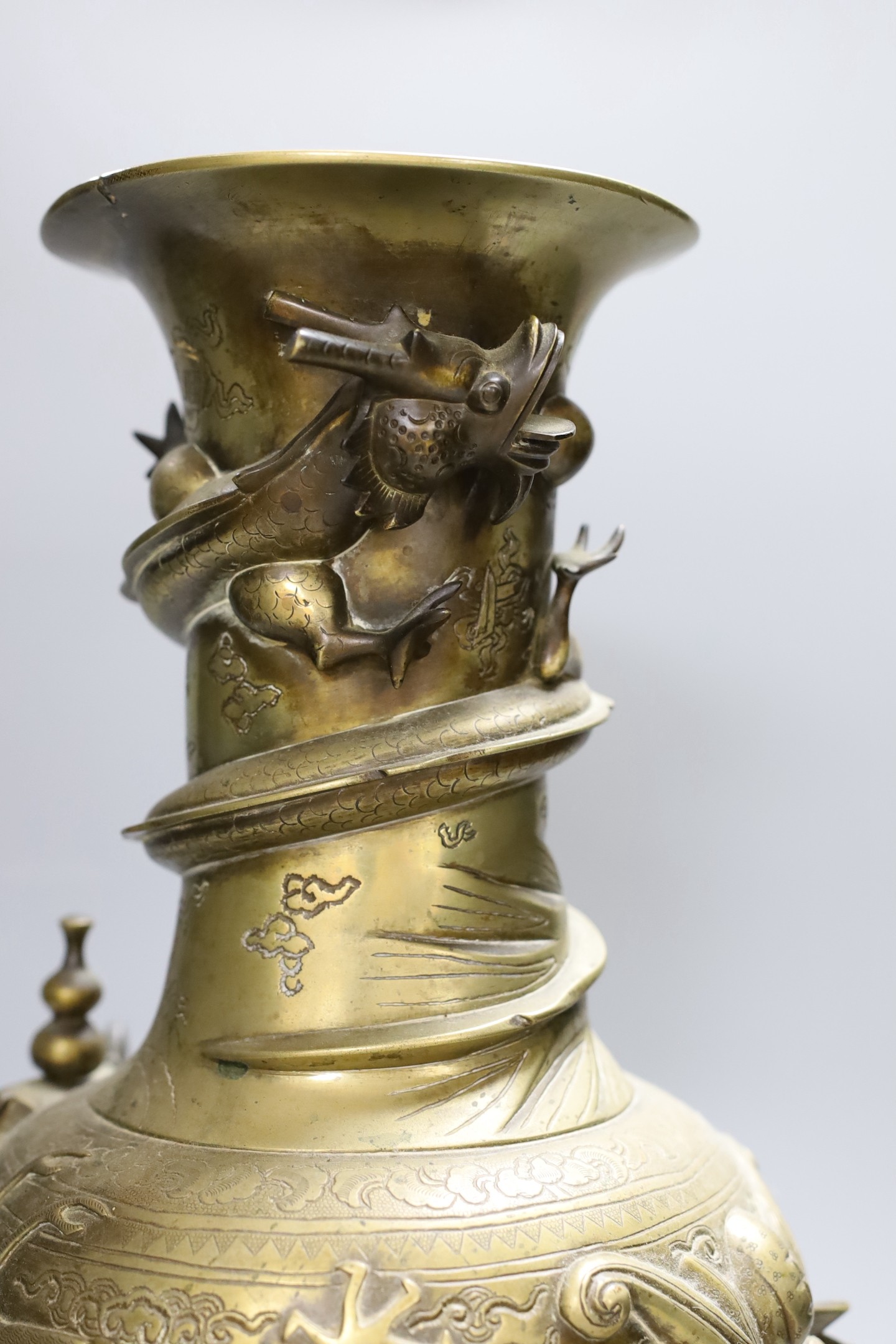 An early 20th century Chinese cast and engraved bronze vase, 42cm
